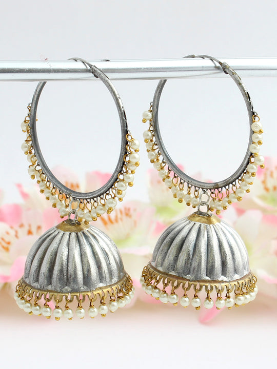 Silver jhumka earrings with white pearls.