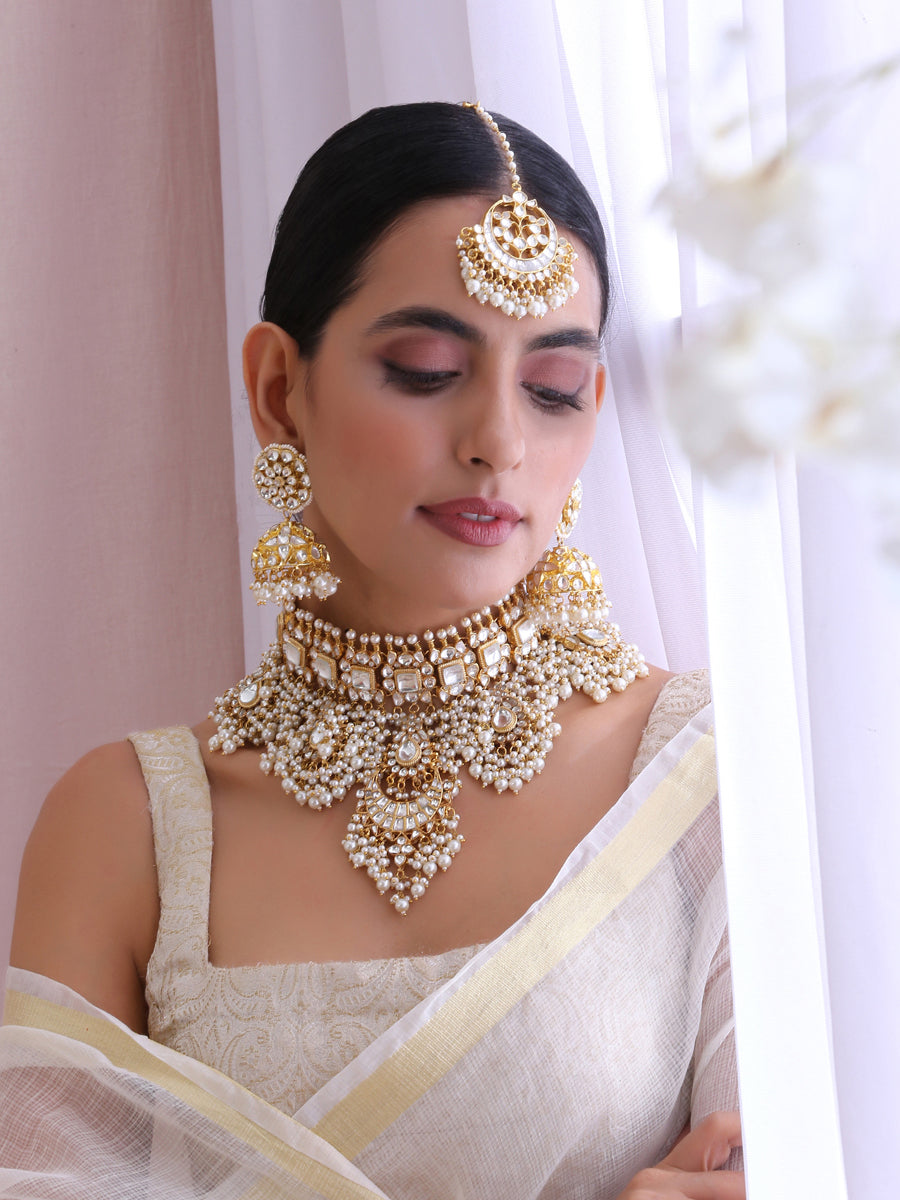 Such a unique way of pairing Indian traditional bridal jewellery on an off  shoulder whi… | White indian wedding dress, Indian wedding gowns, English  wedding dresses